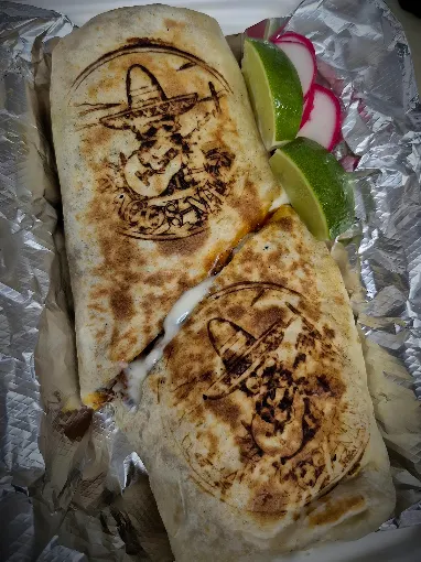 Tacos Meza signature quesadillas branded with the mariachi logo, served with lime and radish